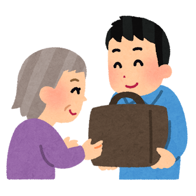 お年寄りの荷物を持つ